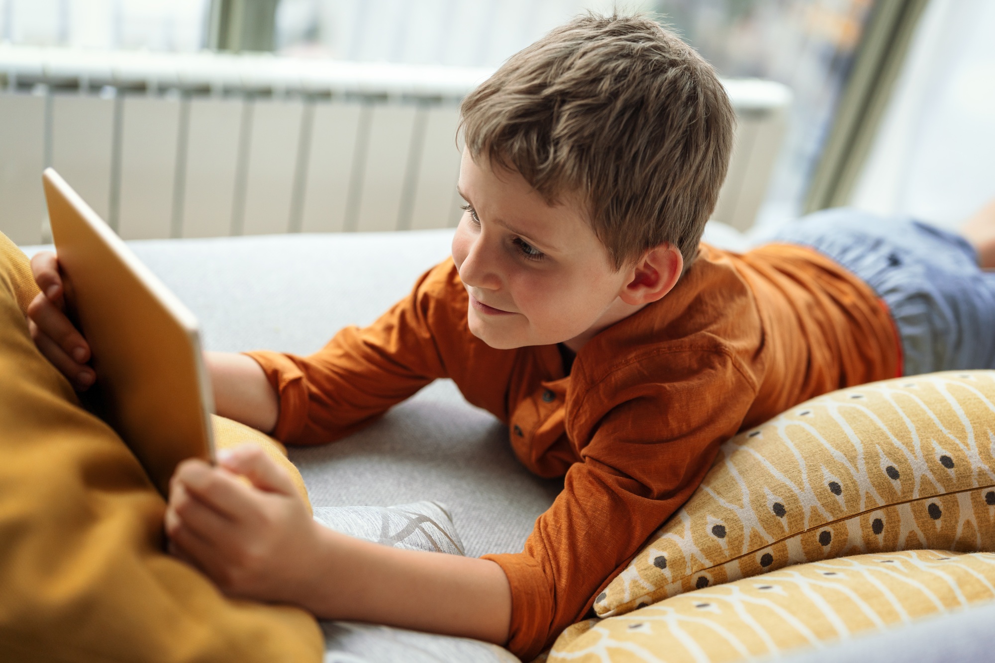 Child playing on digital tablet PC. Technology, kid, child concept