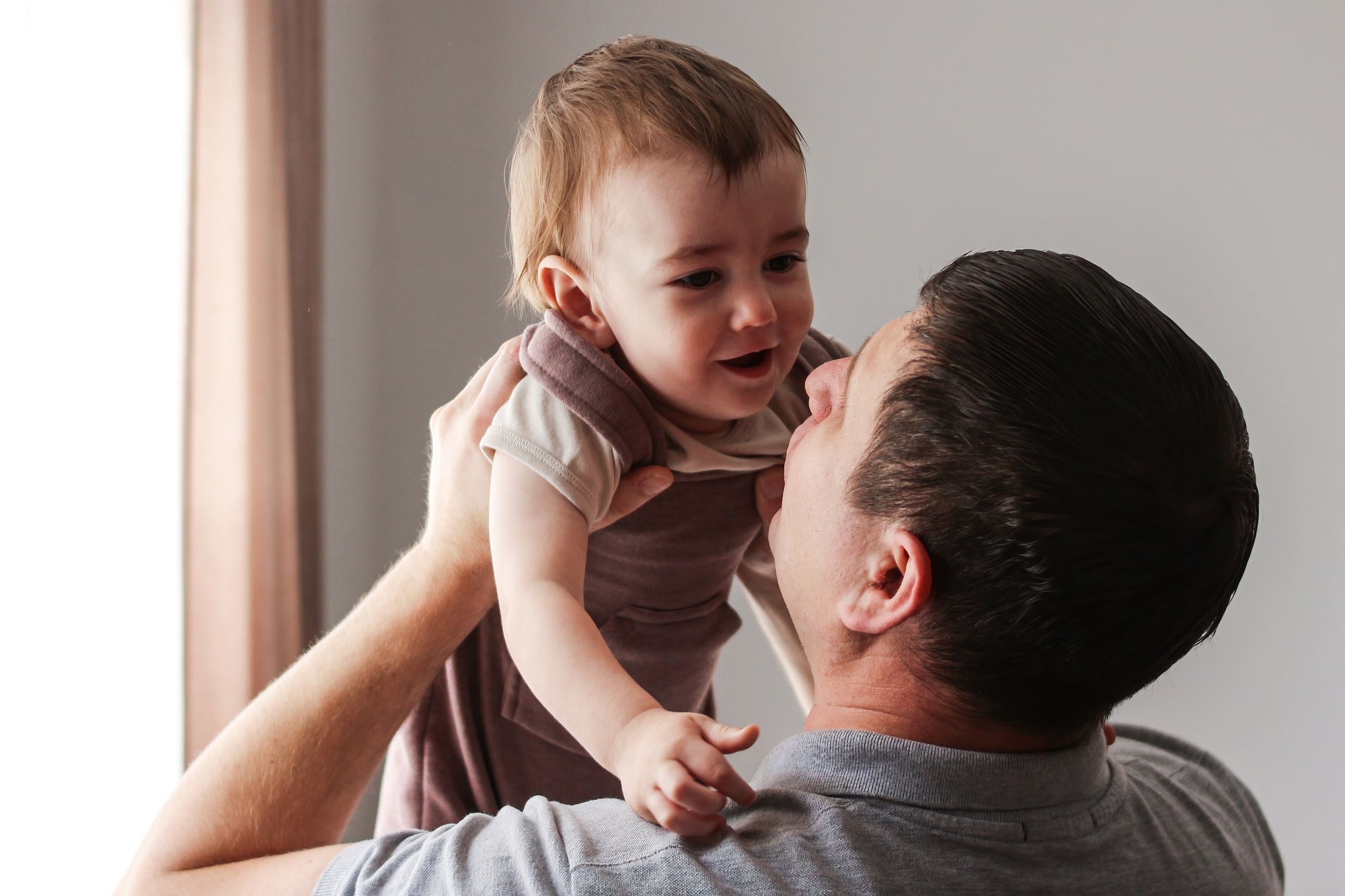 Dad hugs the child with tenderness and love